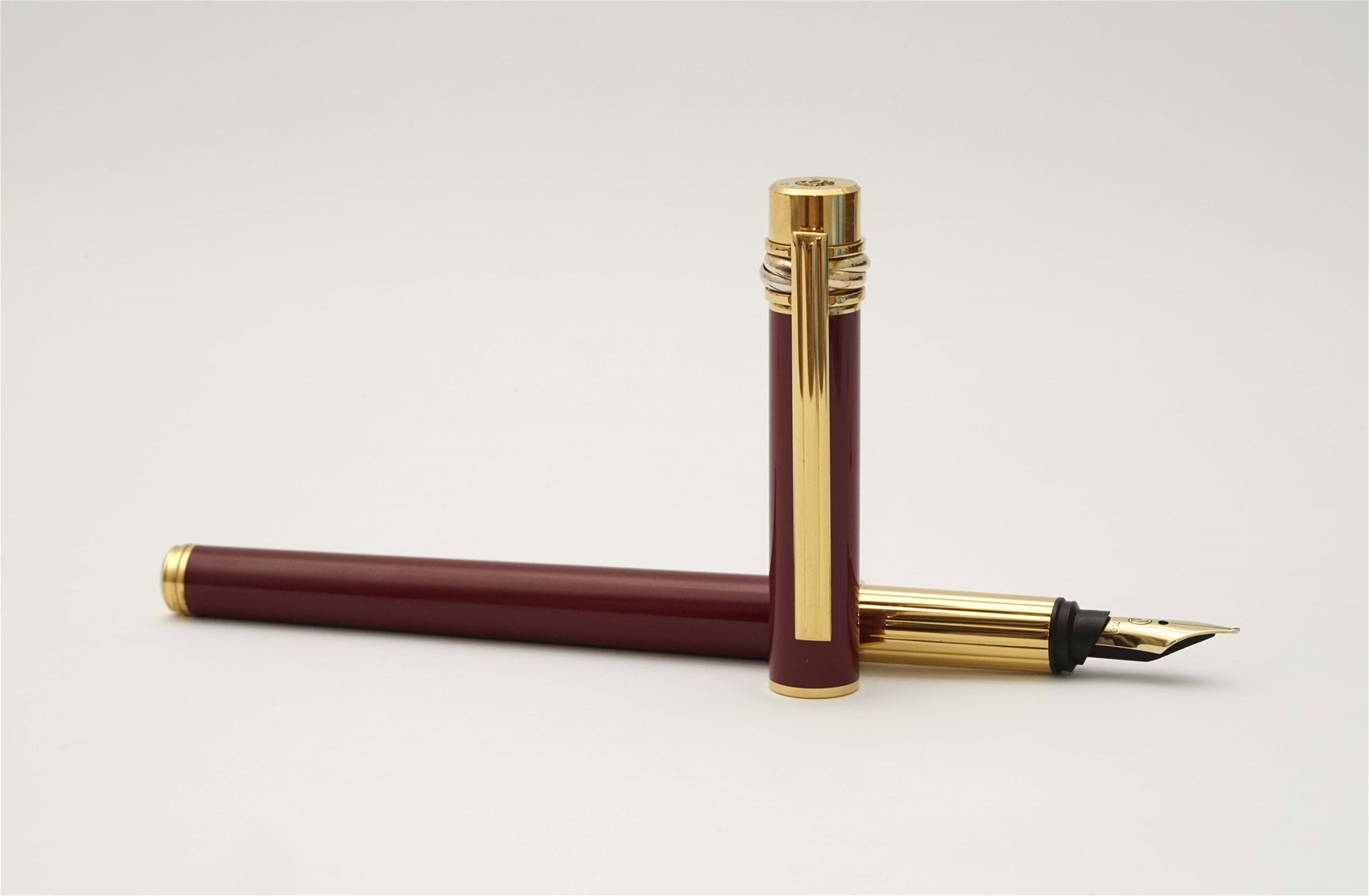 Bút máy Cartier Trinity Burgundy Lacquer & Gold 18K F