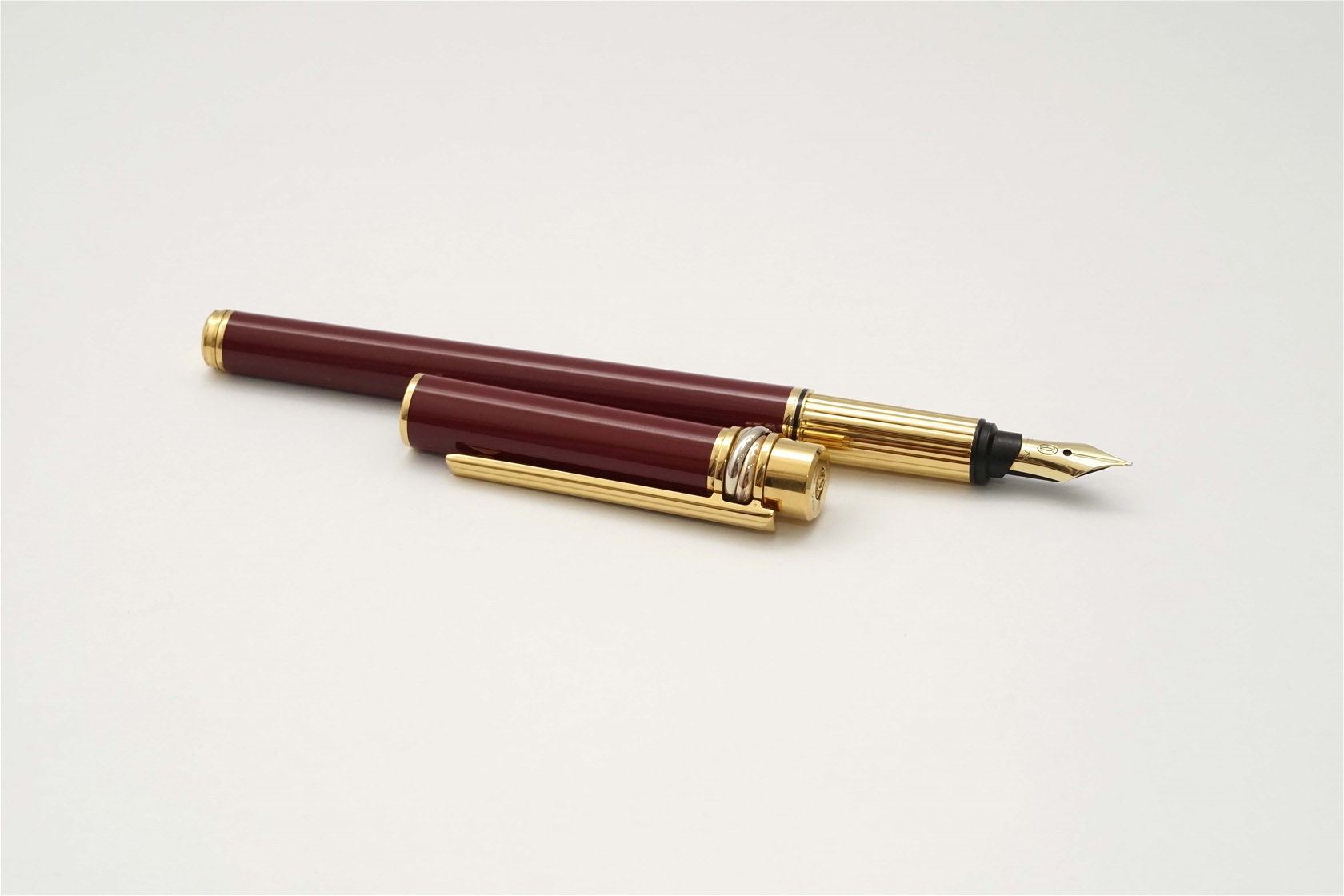 Bút máy Cartier Trinity Burgundy Lacquer & Gold 18K F